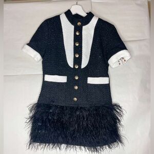 Elegant Black and White Formal Dress with Feather Detail